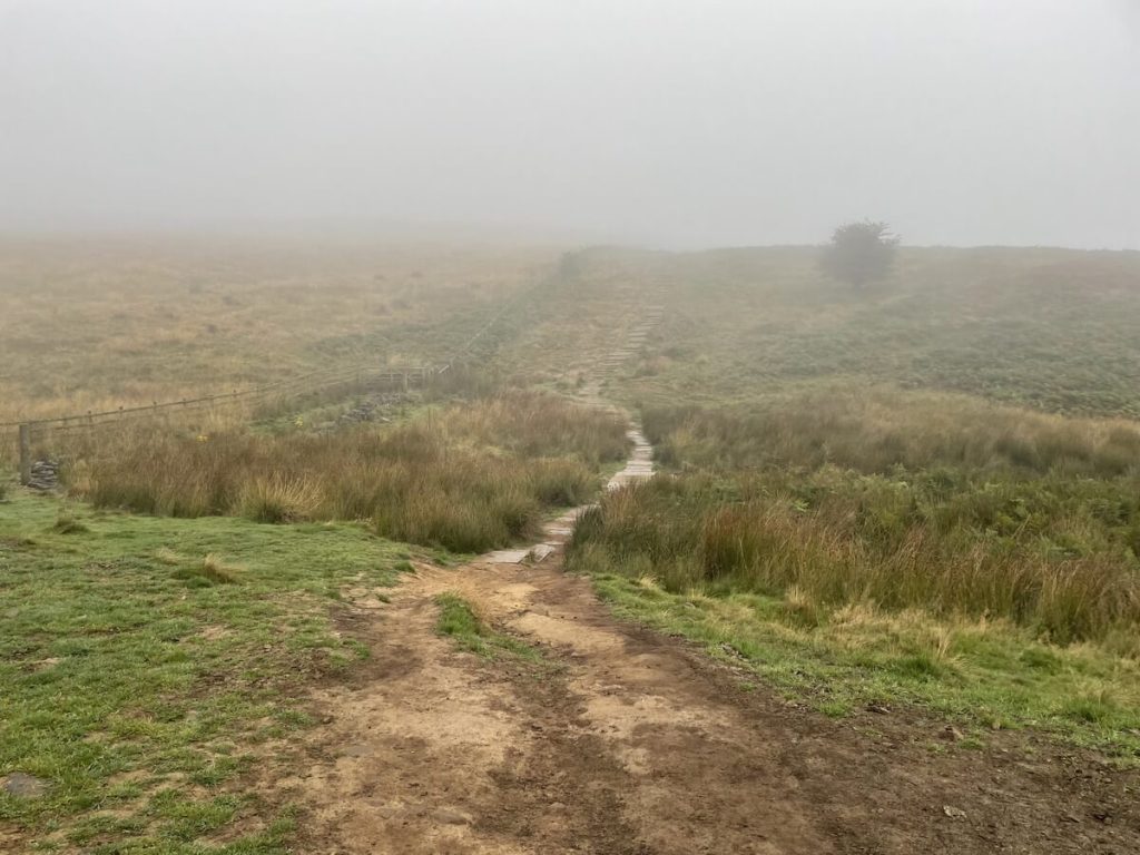 footpath leading along the wall towards white edge