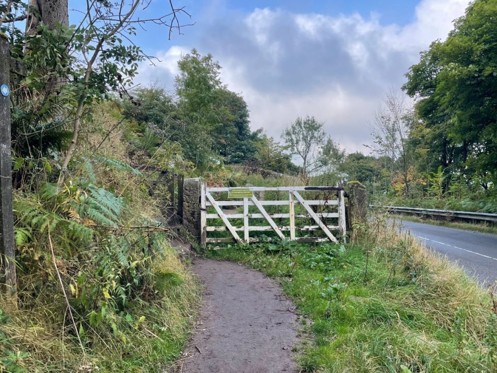 white gate from a625 leading to froggatt edge