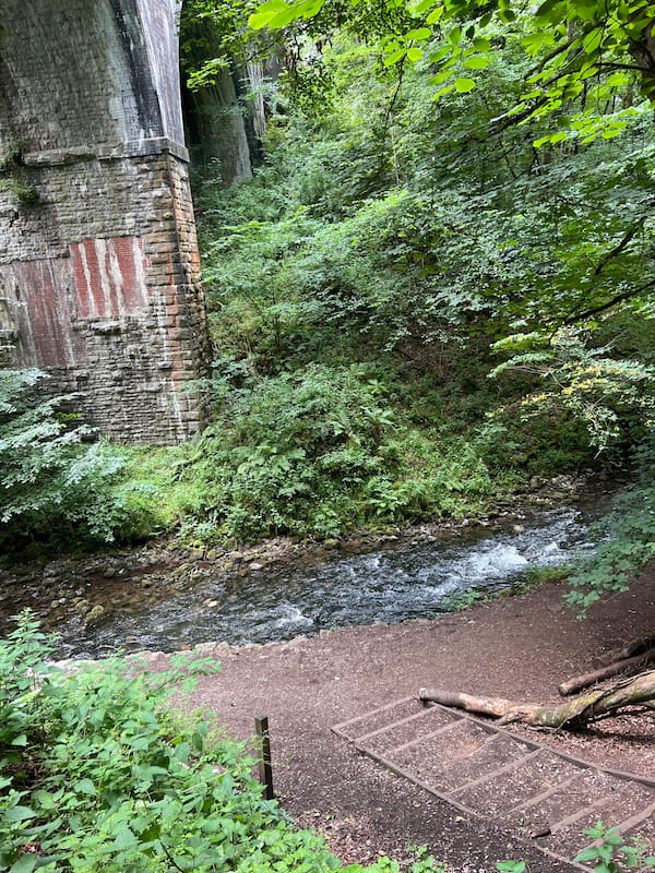 chee dale stepping stones path next to bridge leading to river