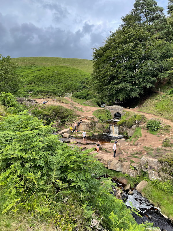 three shires head waterfall with people