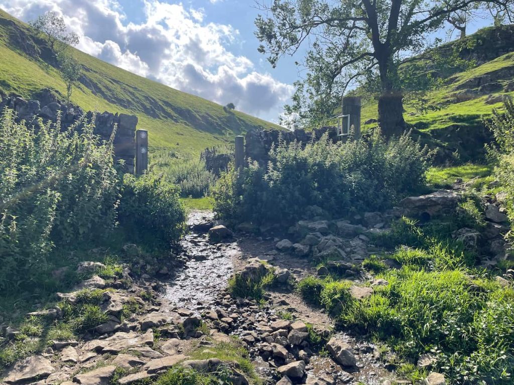 open walled gate at top of cave dale walk