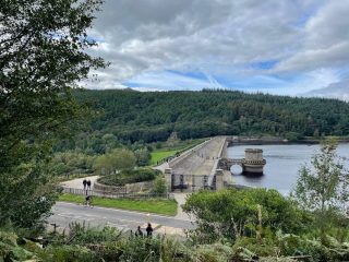 ladybower reservoir with view of win hill peaking out at the top