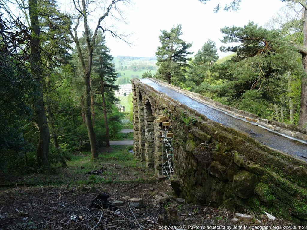 Broken aqueduct with, Chatsworth House in background
