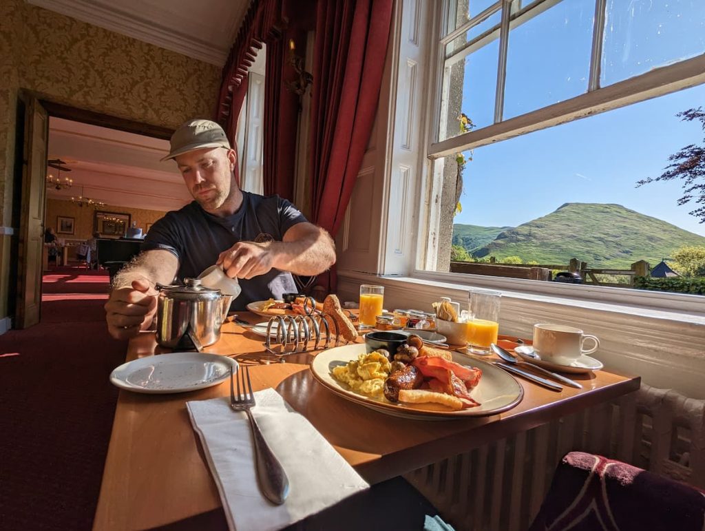 full english breakfast with view of peak district hills