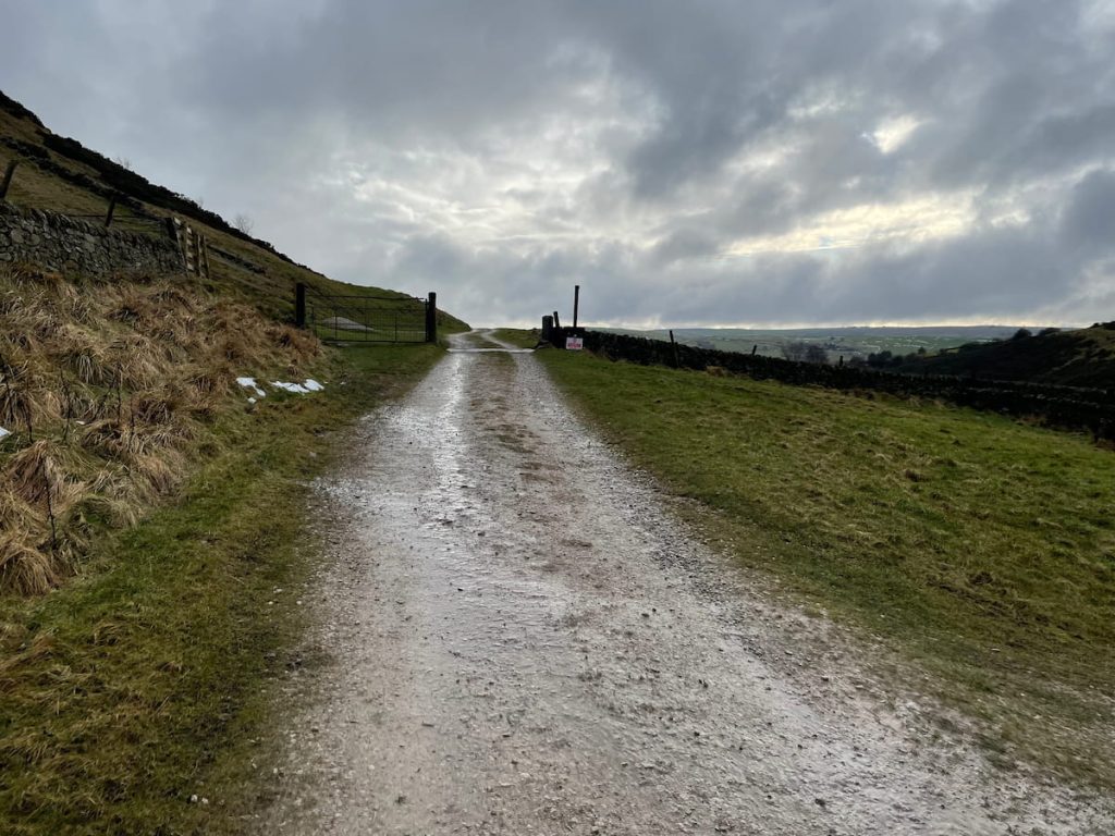 track leading behind hollins hill + no entry sign