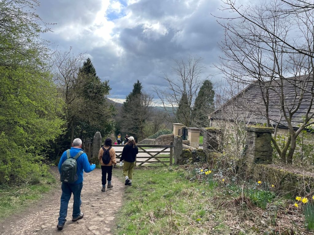 gate and onto the gravel road, which leads back to Grindleford train station