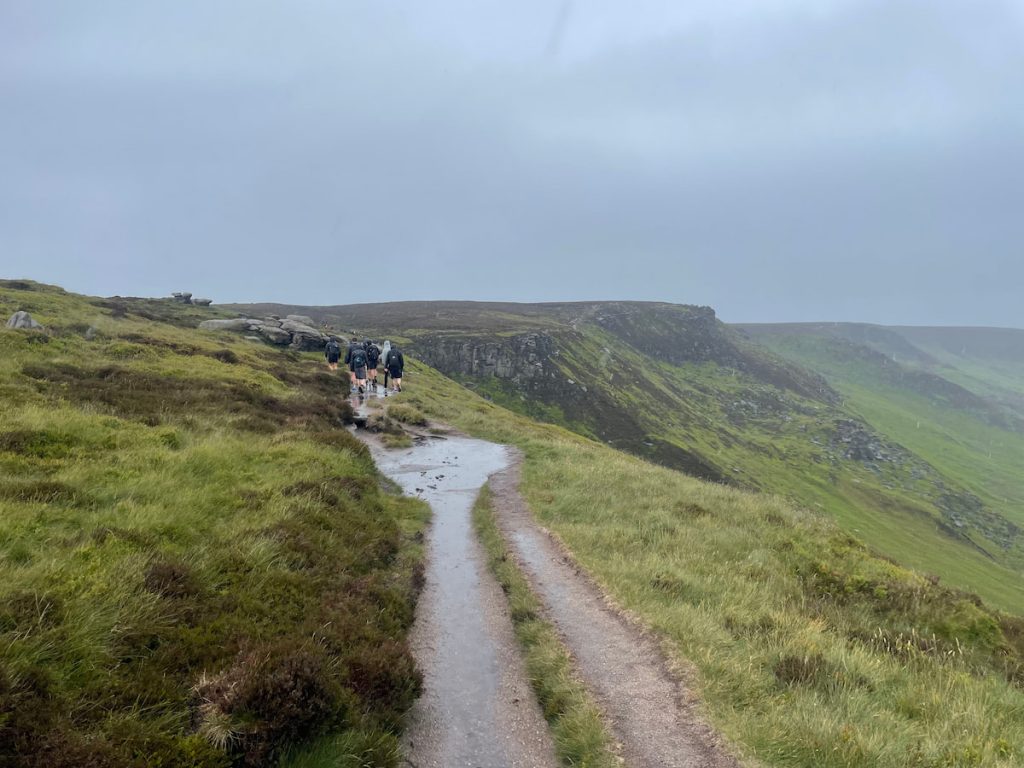 path curves around slightly as you leave the peak of kinder scout moorland