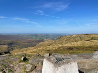 higher shelf stones trig point with view over moorland