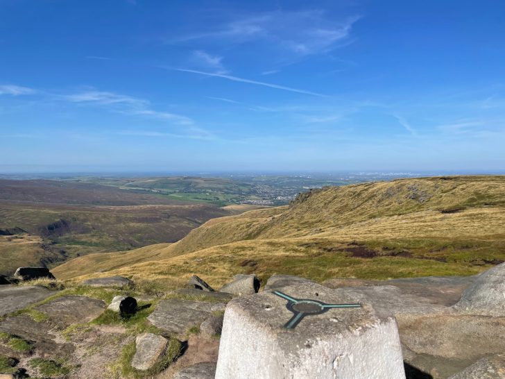 higher shelf stones trig point with view over moorland