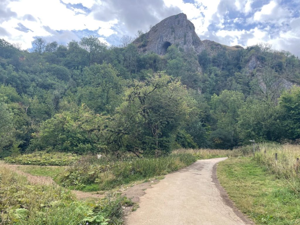 view of thors cave in hillside from mainfold valley